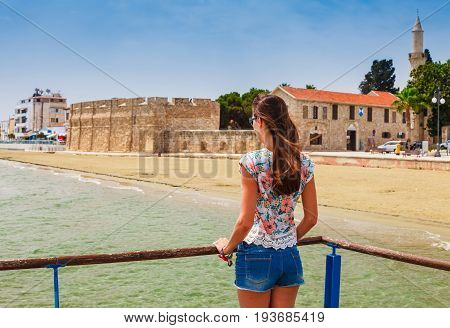 Young Tourist Woman Looking At Medieval Castle In Larnaca,cyprus