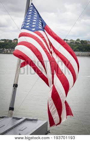 Ship Tour USS Kearsarge (LHD 3) Wasp-class amphibious assault ship: American Flag flies from the bow of the USS Kearsarge (LHD 3). Fleet Week NEW YORK MAY 25 2017.