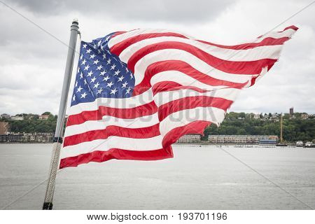 Ship Tour USS Kearsarge (LHD 3) Wasp-class amphibious assault ship: American Flag flies from the bow of the USS Kearsarge (LHD 3). Fleet Week NEW YORK MAY 25 2017.