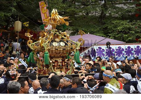 2017 05 28. SHINJUKU TOKYO JAPAN. People are carrying a portable shrine on their shoulders and walking around shinjuku city. known as OMIKOSHI MASTURI FESTIVAL at HANAZONO JINJA, SHINJUKU TOKYO JAPAN