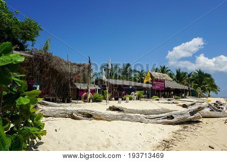 Labuan,Malaysia-May 1,2017:Colourful resort chalets with beautiful sandy beach at Rusukan Besar island in Labuan,Malaysia.It is a popular place for tourist to visit & snorkeling underwater in Labuan