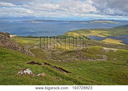 General view from The Storr with Loch Leathan and the Isle of Raasay in the background, Isle of Skye, Highlands, Scotland, UK