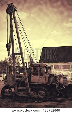 Old Rusty Tractor Abandoned In A Landfill.