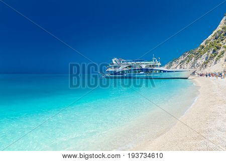 Tourist ship on the Egremni beach Lefkada Greece.