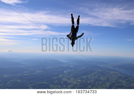 Skydiving over beautiful Norway. Clouds, sun and sky