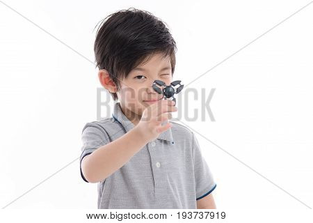 Asian Chld  Holding Two Fidget Spinners
