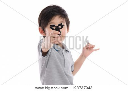 Asian Chld  Holding Two Fidget Spinners