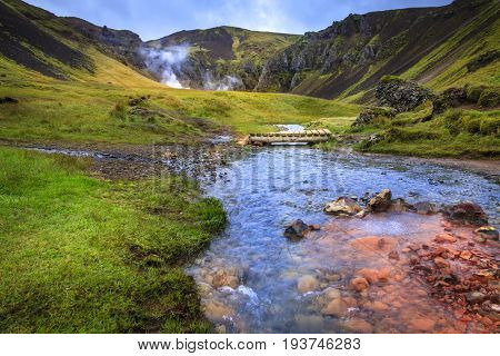 Foot bridge over Hot River in Reykjadalur Valley in South Iceland