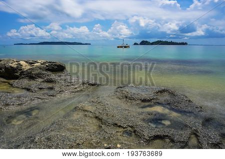 Tropical beach background and wonderful nature landscape with sandy beach with beautiful coral in Rusukan Besar island,Labuan,Malaysia.