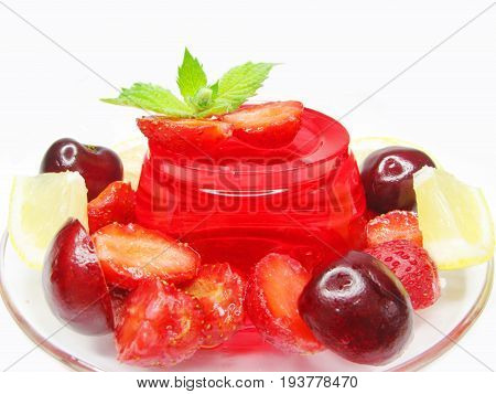 strawberry jelly gelatin dessert with cherry and lemon