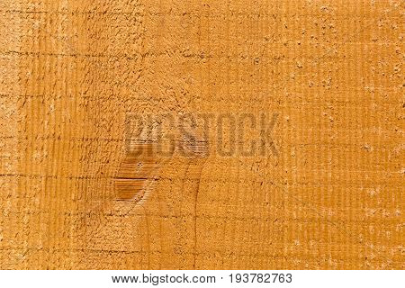 Part of light uncolored rough wooden plank with knots. Textured. Close shot.