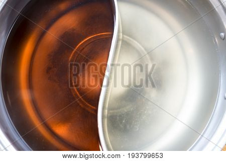Chinese food hotpot two styles of shabu soup top view