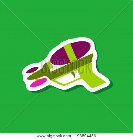 paper sticker on stylish background Toy gun