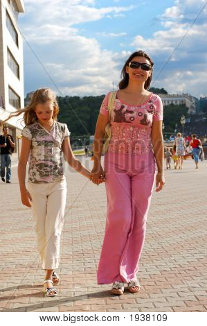 Mother And Daughter Walking