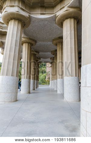 Outer line of columns under nature square at Hypostyle Room in Park Güell Barcelona