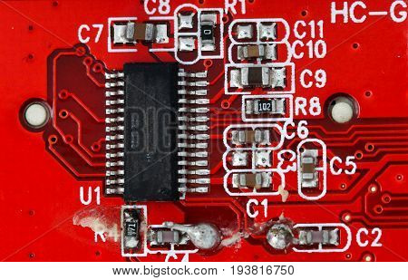 Macro Shot Of An Old Damaged Orange Or Red Circuit Board
