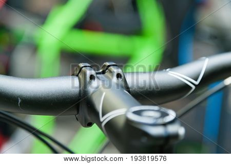 Black steering wheel attached to the drill