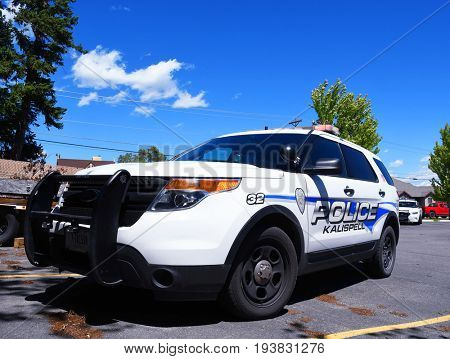 KALISPELL, MONTANA, USA - June 21, 2017: Kalispell Police Department SUV on scene with its flashing lights on in a parking lot