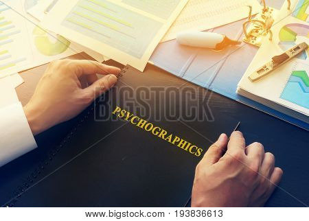 Manager taking a book with name psychographics.