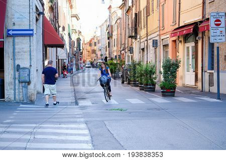 Ferrara, Italy - June, 30, 2017: pedestrian cross on a street in a center of Ferrara, Italy