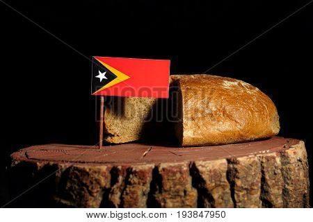 East Timorese Flag On A Stump With Bread Isolated