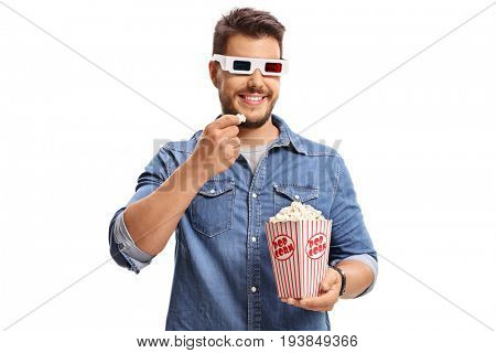 Man wearing a pair of 3D glasses and eating popcorn isolated on white background