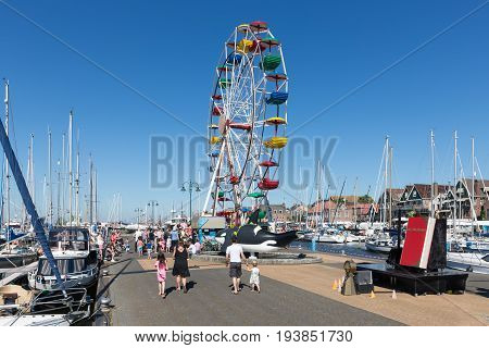URK THE NETHERLANDS - MAY 27 2017: Ferris wheel at harbor of Urk during a local fishing day event
