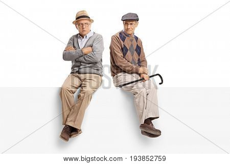Angry seniors sitting on a panel isolated on white background