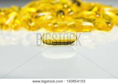Fish oil gel capsules of omega 3. Copyspace added. Close up capsules fish oil on white background. The supplement high vitamin E omega 3 and DHA.