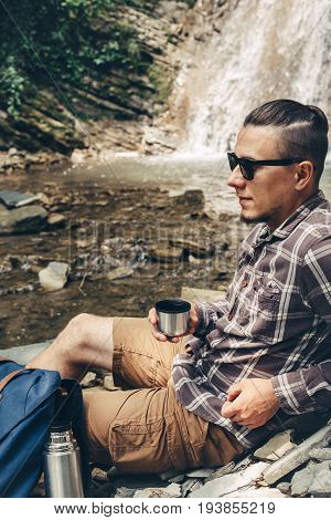 Male Hiker Rest And Drink Tea Or Coffee From Thermos Hiking Leisure Vacation Travel Concept
