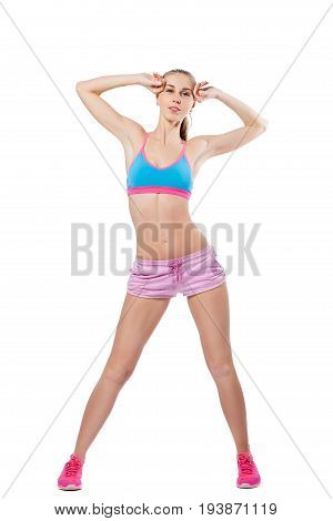 A young slender woman is engaged in fitness. Isolated white background