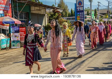 CHIANGMAI THAILAND - JANUARY 25 2015: Multi indigenous peoples in parade of 22nd Traditional Skirt Fabric and The Indigenous Product and Culture Festival in Mae Chaem Chiangmai Thailand