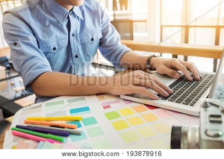 Hands Of Female Hipster Modern Graphic Designer In Office Working With Colour Samples. Woman At Work