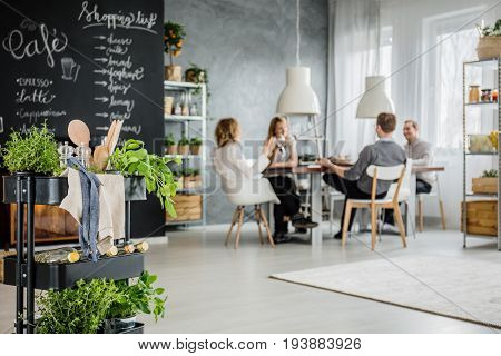 Roommates hanging out together in their loft apartment