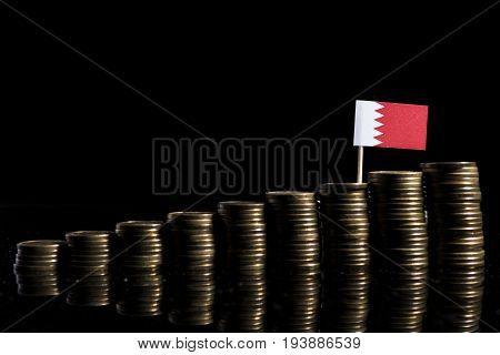 Bahraini Flag With Lot Of Coins Isolated On Black Background