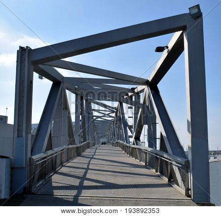 Bridge gangplank metal-worker on port of sea
