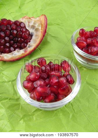 Fresh raw pomegranate seeds in a little bowl