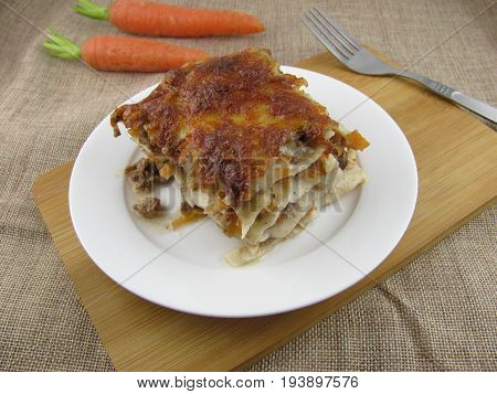 Freshly baked lasagne with minced meat and carrot