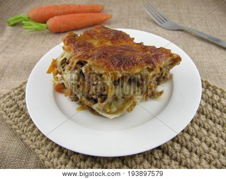 Freshly baked lasagne with minced meat and carrot