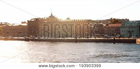 Panorama Of The Morning Sun Illuminates The City Street And Houses Standing On The Embankment Of The