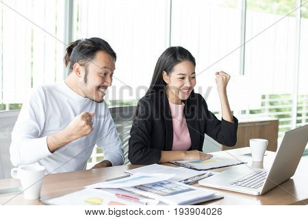 Asian Man Working Project With Woman At Office Place People Successful Concept 20-30 Years Old.