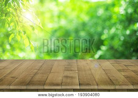 Empty wooden table for product placement or montage with focus to table top in the foreground, with white background. Wooden board empty table perspective.