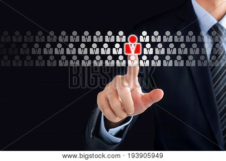 Businessman hand touching red human icon on virtual screen - stand out from the crowd HR and HRM concepts