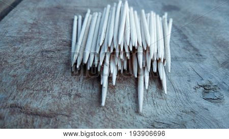 tooth picks abstract composition on wood background