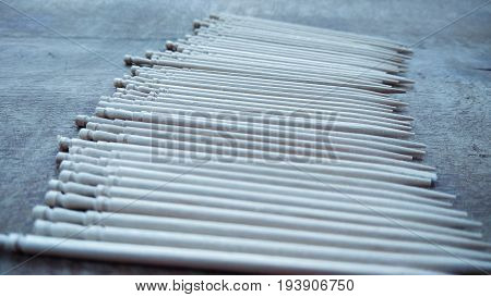 tooth picks abstract composition on wood background
