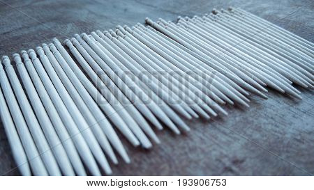 tooth picks abstract composition on wood background
