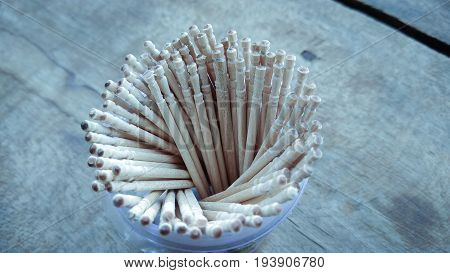 abstract wooden tooth picks on wood background