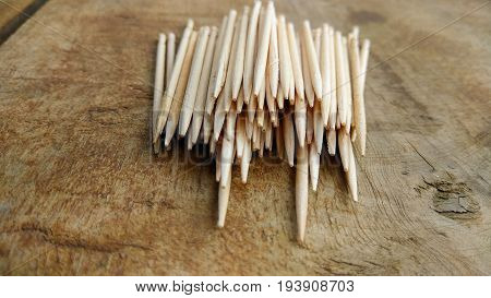 tooth picks abstract composition background in wood