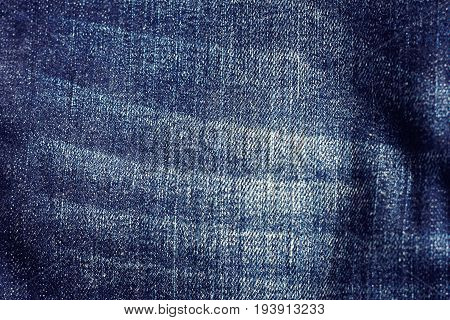 Denim blue jeans texture with space for text Indigo plain surface Indigo classic vintage Close-up of details of a pair of jeans trousers Fabric Background