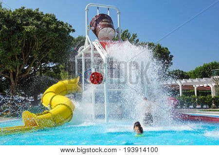 Torvaianica, Italy - July 2017: People having fun in the swimming pool in water park at Zoomarine acqua park .